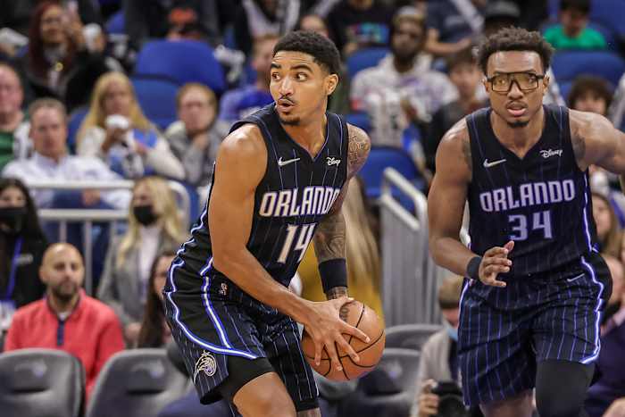 Jan 28, 2022; Orlando, Florida, USA; Orlando Magic guard Gary Harris (14) grabs the rebound and looks to pass against the Detroit Pistons during the second half at Amway Center.